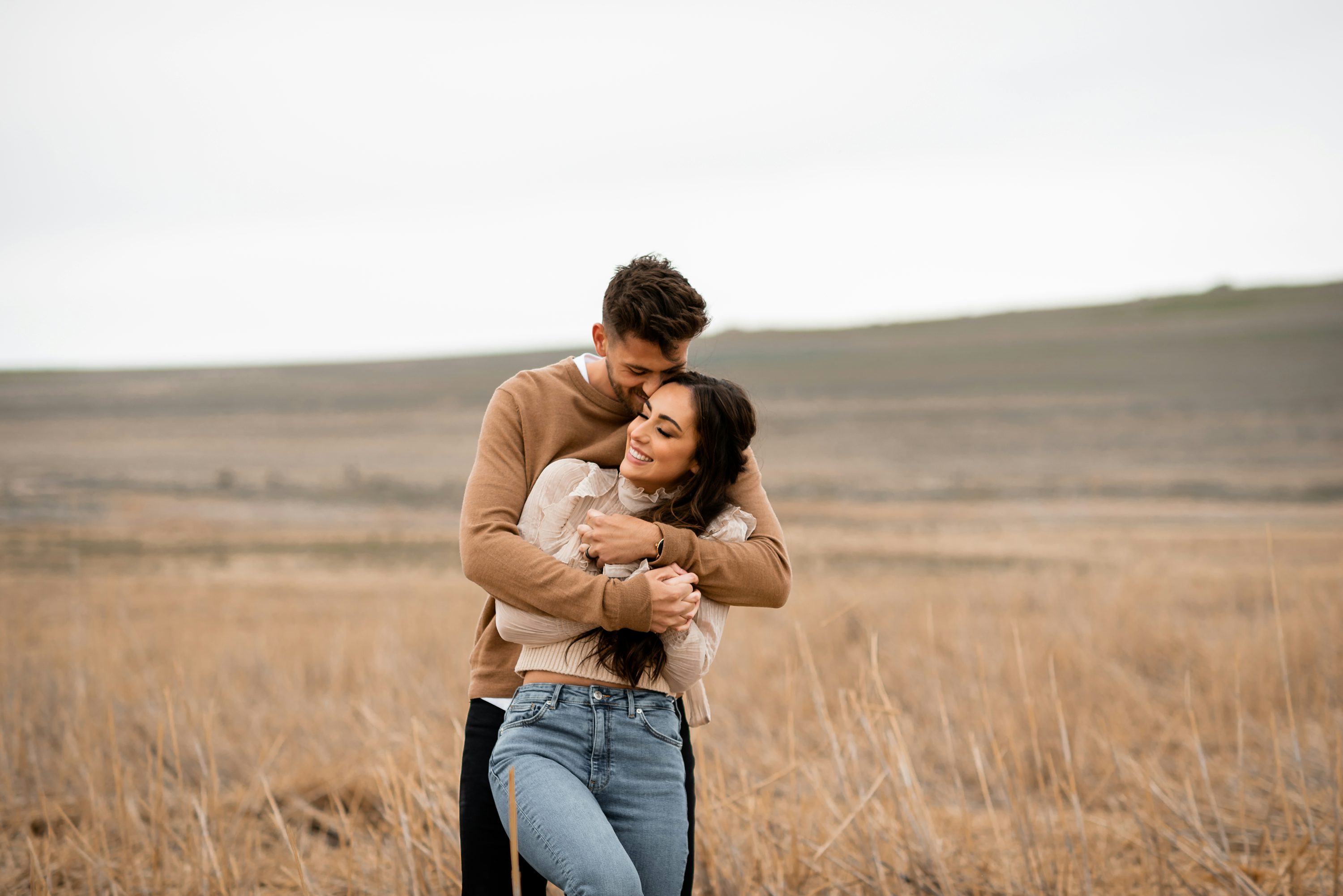 Couple smiling naturally during a candid photo session